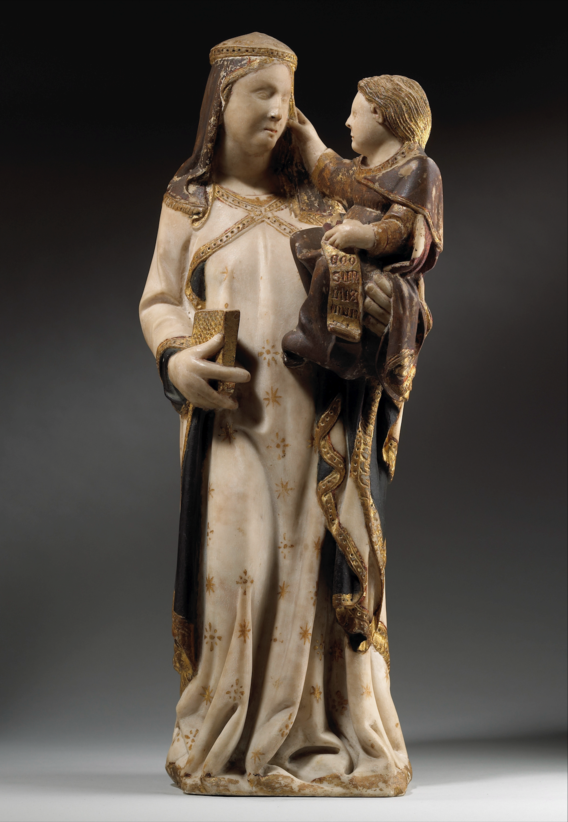 A Polychrome and Parcel-Gilt Marble Group of theVirgin and Child